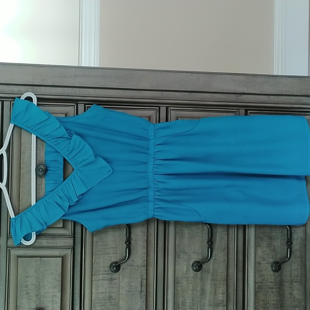 Aqua colored, just above knee length dress with pockets size S